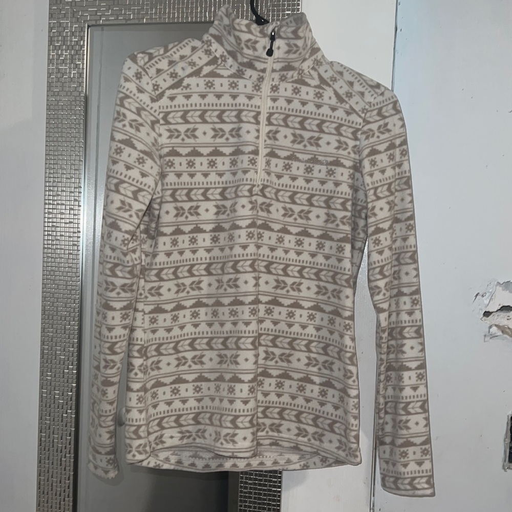 It’s a tan and white sweater never used a size small